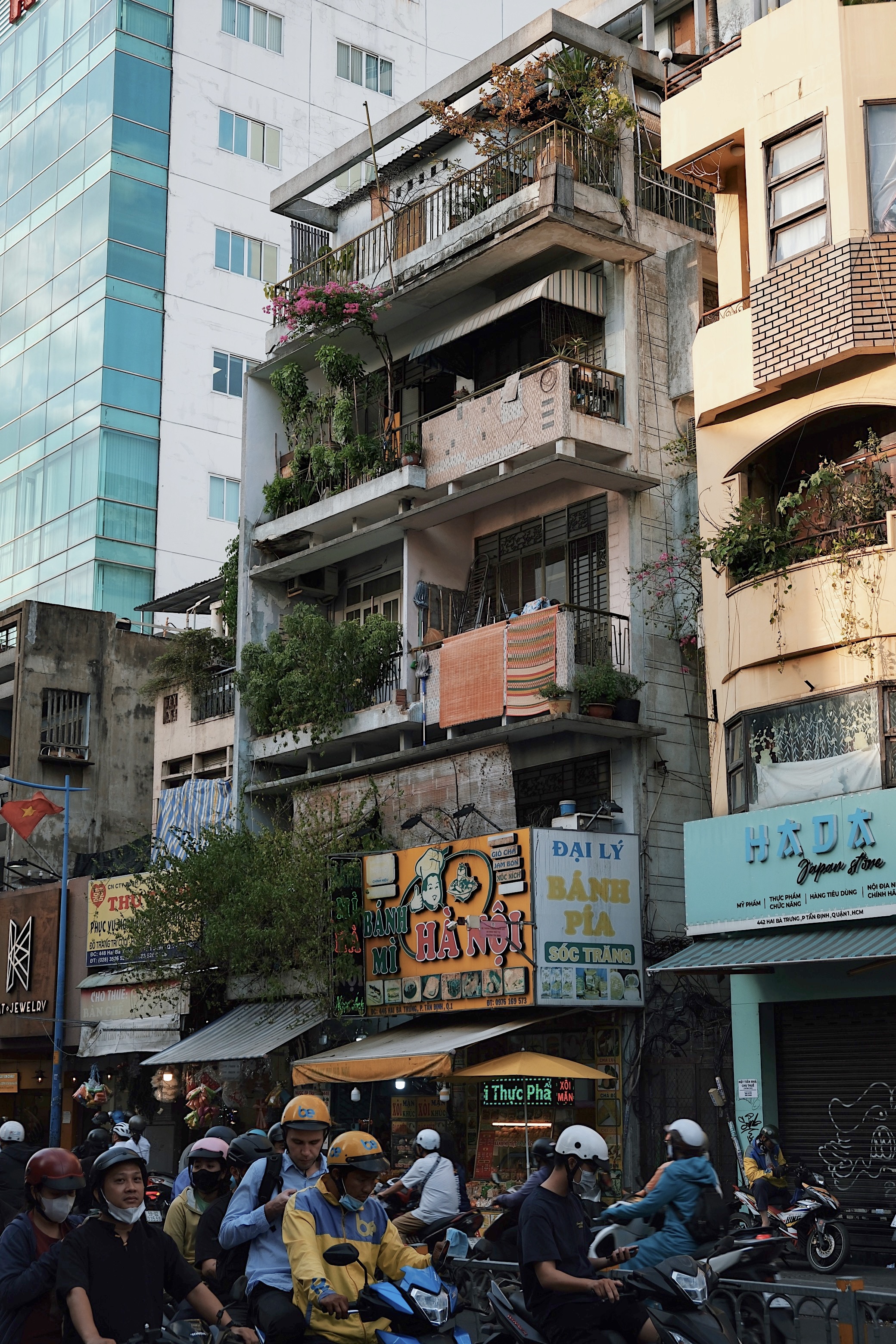 South Vietnamese modernist townhouses in Ho Chi Minh City, showcasing perforated concrete ventilation blocks and sculptural facades.