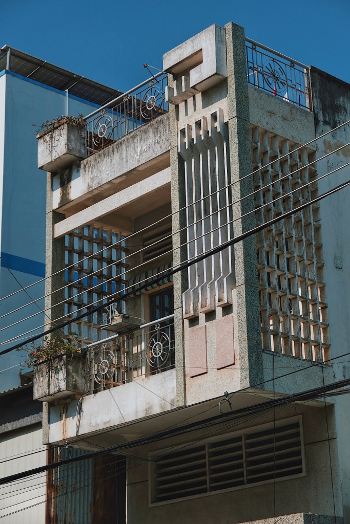 Detail of a shophouse in Chau Doc with intricate geometric modernist architecture.
