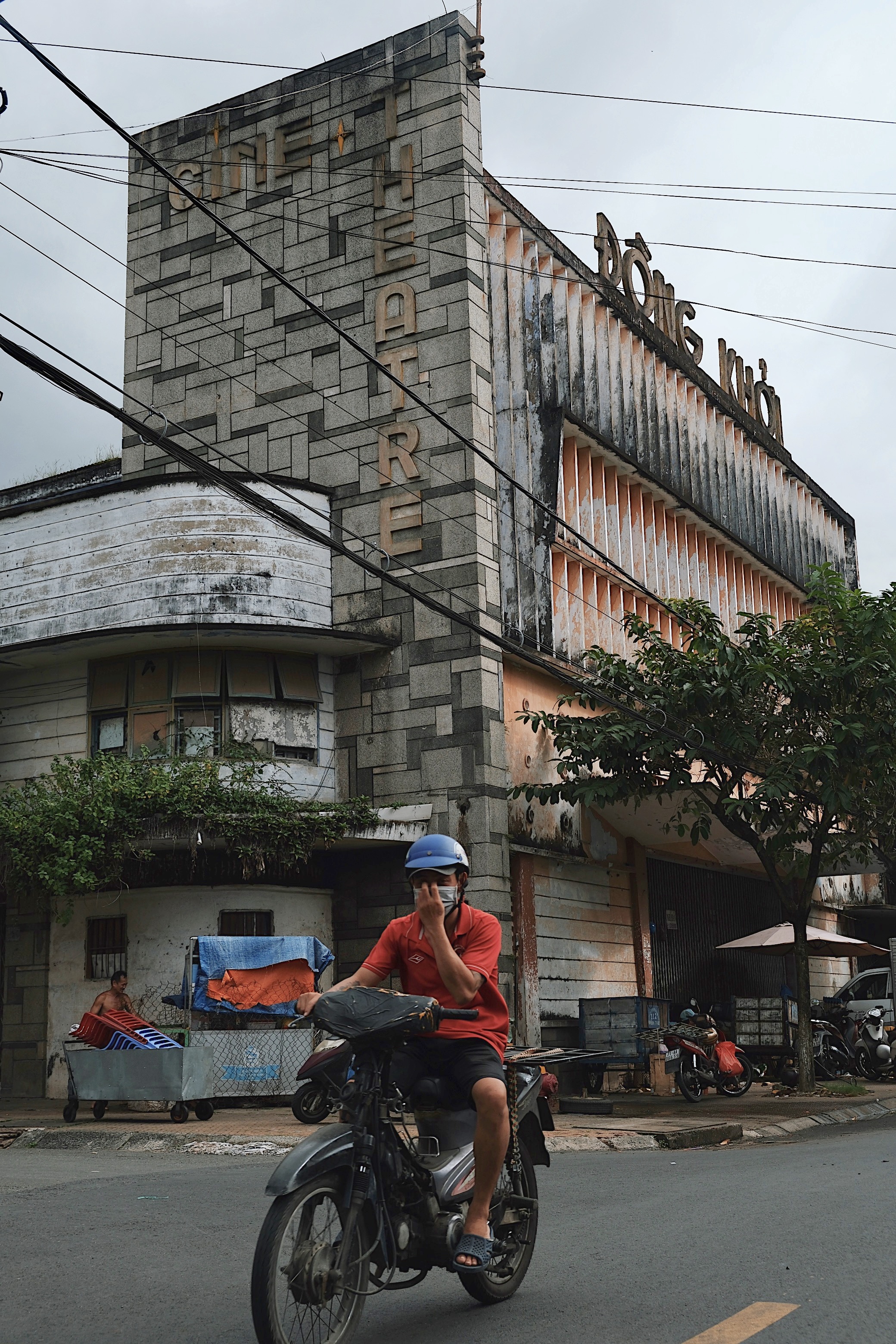 A modernist movie theater in Ben Tre, Vietnam, with bold geometric forms and raw concrete materials reflecting Brutalist influences.