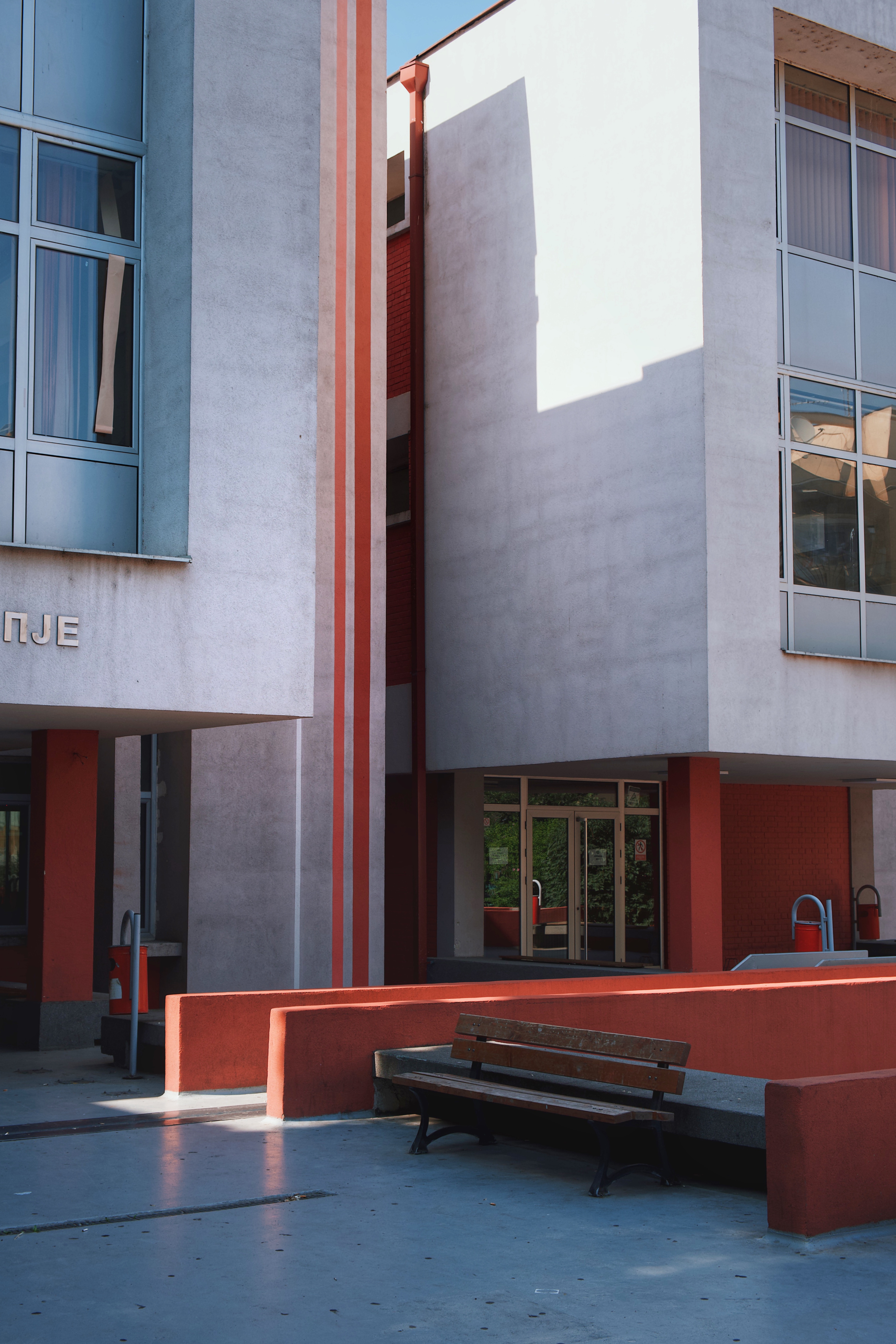 Concrete entrance and clean-lined geometry at Josip Broz Tito High School, an example of late modernist architecture in Skopje’s educational infrastructure